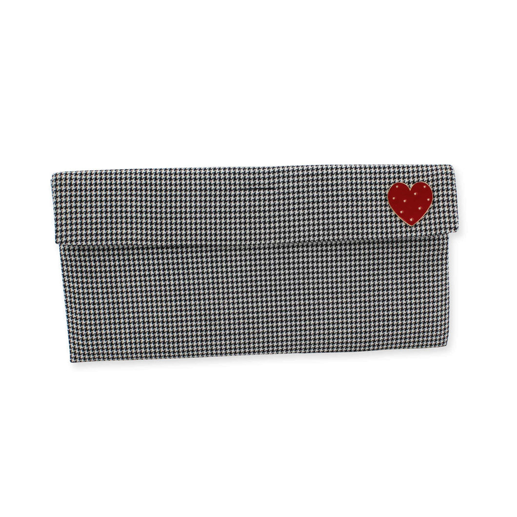 Houndstooth clutch bag with red heart brooch